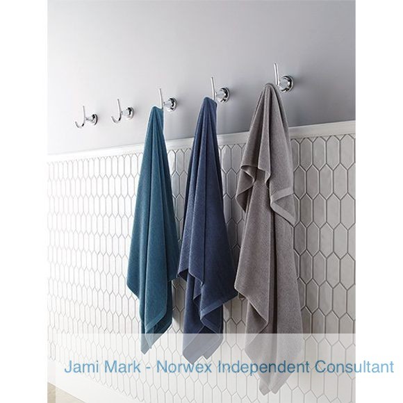 Norwex bath towels hanging up in a bathroom