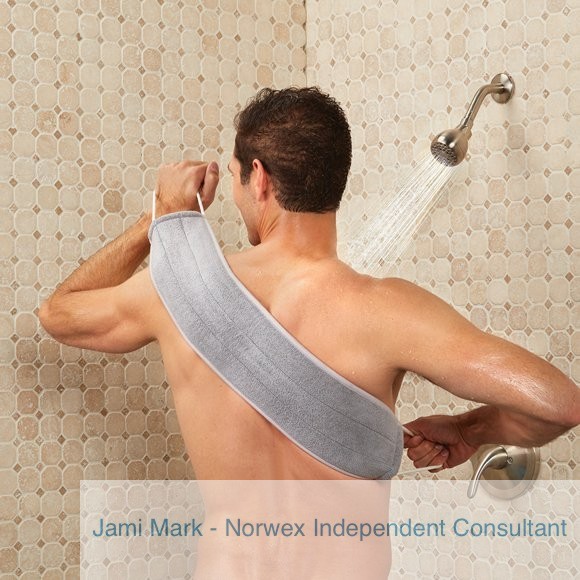 Man using the Norwex exfoliating back scrubber in the shower