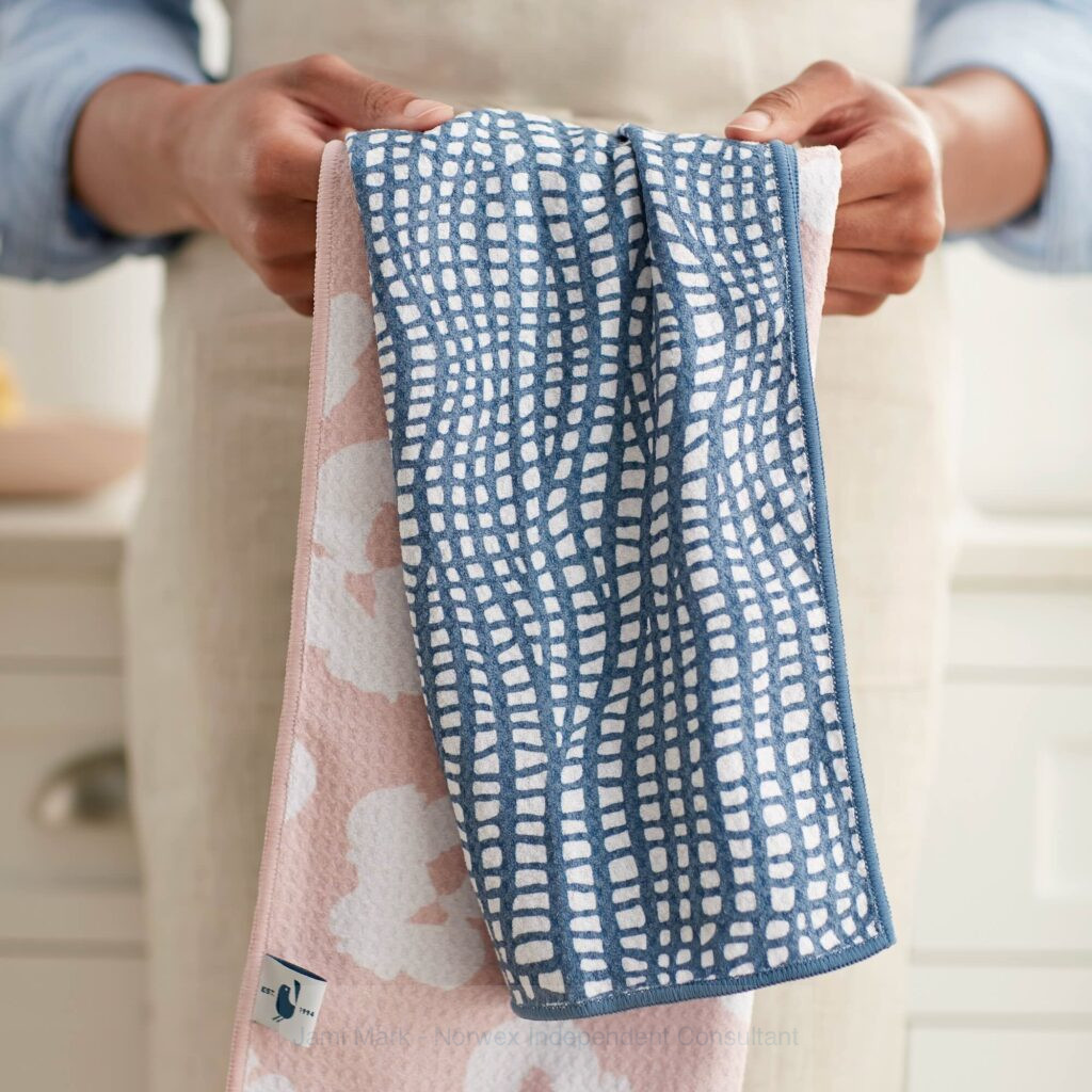 Woman holding Norwex Tea Towels in the kitchen